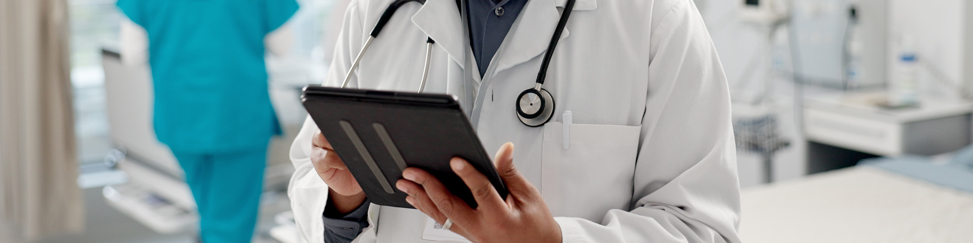 doctor holding tablet