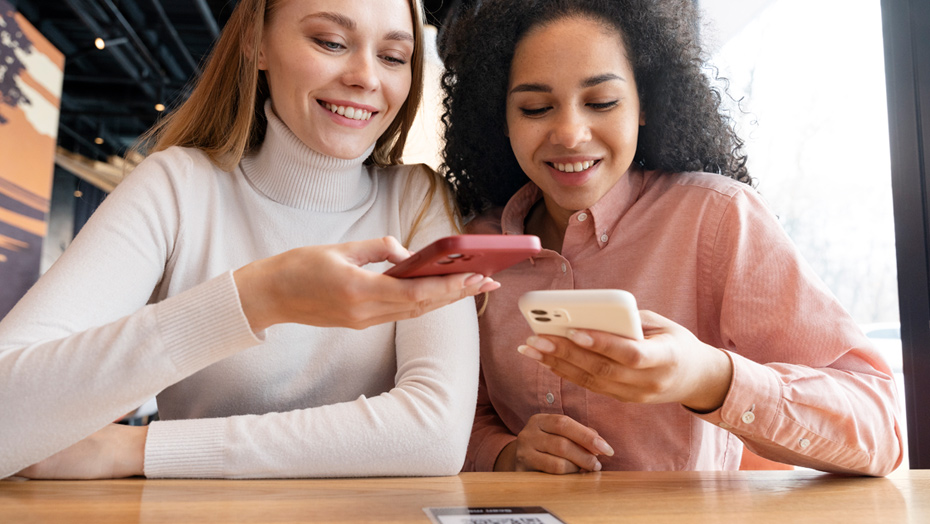young girls looking at their phones